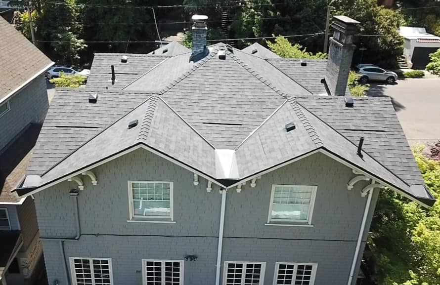 A top view of a residential roof with asphalt shingles