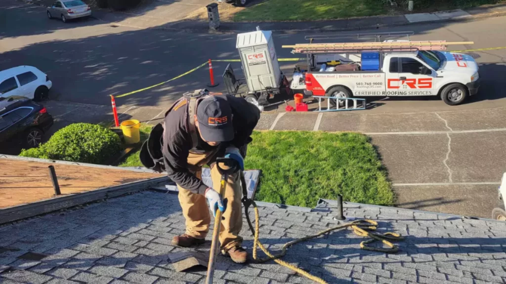 Certified Roofing Services contractor performing roof inspection in Portland. replace a roof.